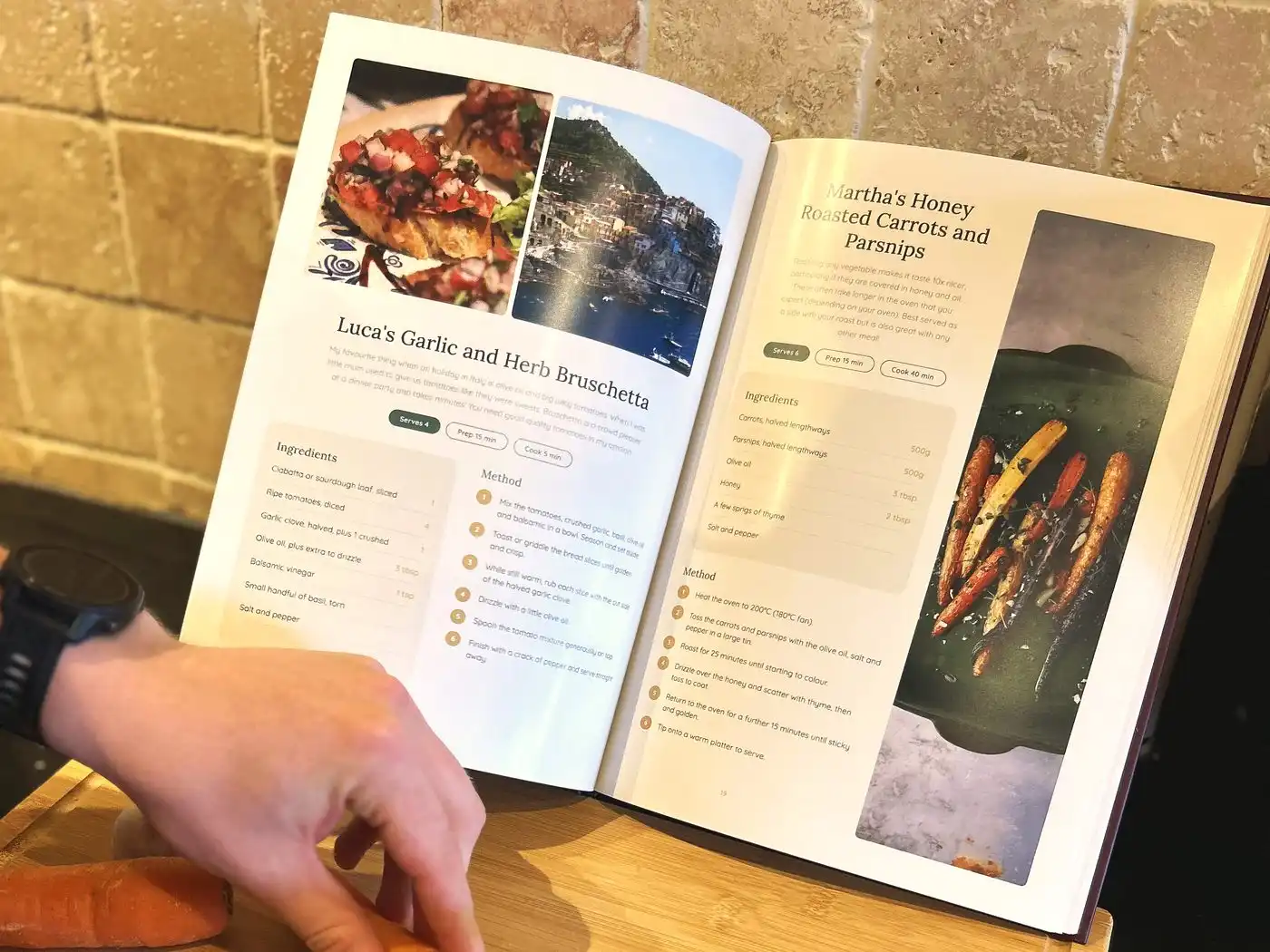 An open anniversary cookbook showing a bruschetta recipe with a photo of the Italian coast where the couple first ate it