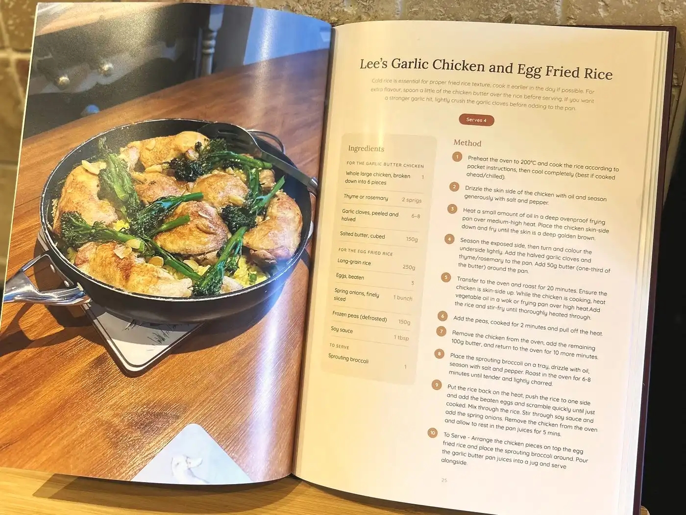 An open family cookbook showing a roast chicken recipe beside a full-page photo of it fresh from the oven