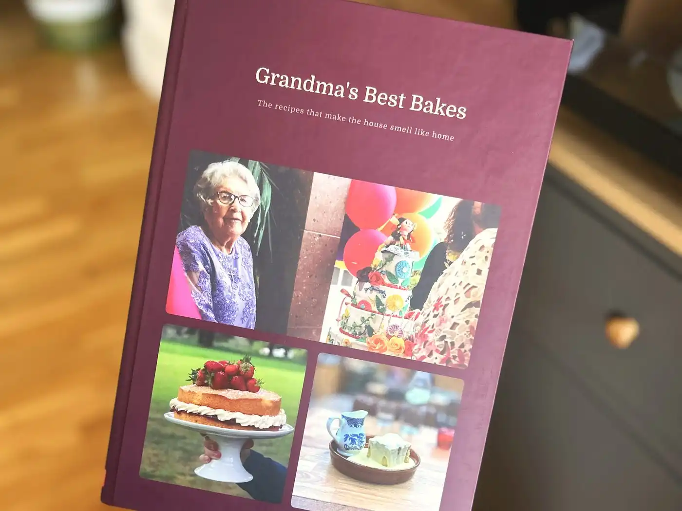 A finished hardback personalised cookbook with a cover made from a family's own photographs